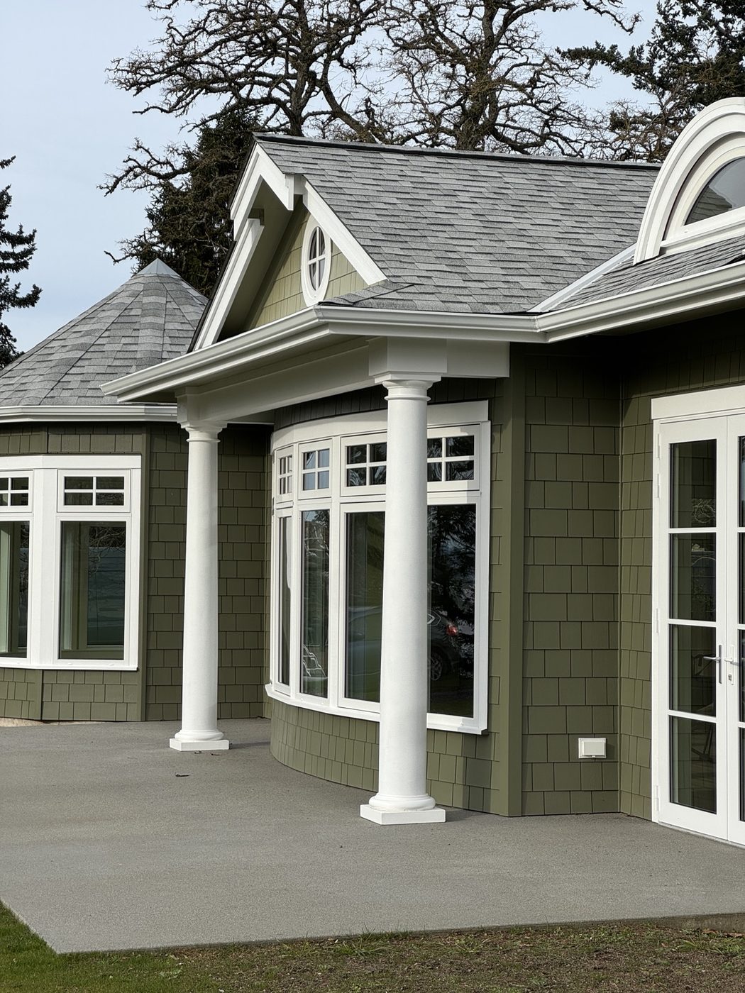 High-end green shingle custom home